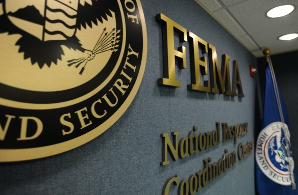Washington, DC, June 4, 2009 -- Part of the DHS seal, the FEMA logo and the DHS Flag, on the wall in the National Response and Coordination Center. FEMA/Bill Koplitz