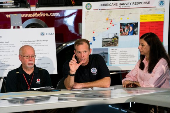 Brock Long, center, at a briefing on Hurricane Harvey relief efforts with President Trump and local organizations in Corpus Christi, Tex., last week. Credit Doug Mills/The New York Times